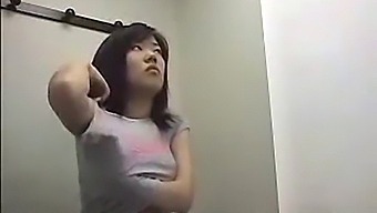 Voyeuristic Footage Of Asian Women Undressing In A Dressing Room