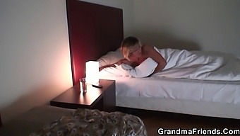 Mature Blonde Enjoys A Threesome With Two Young Guys
