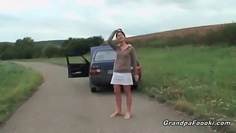 Young Woman Entices Elderly Man In Public